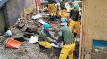 災救隊岡山教区隊は新見市へ出動し、土砂に埋もれて重機の使用が困難な現場など、一般ボランティアが請け負えない作業を担った